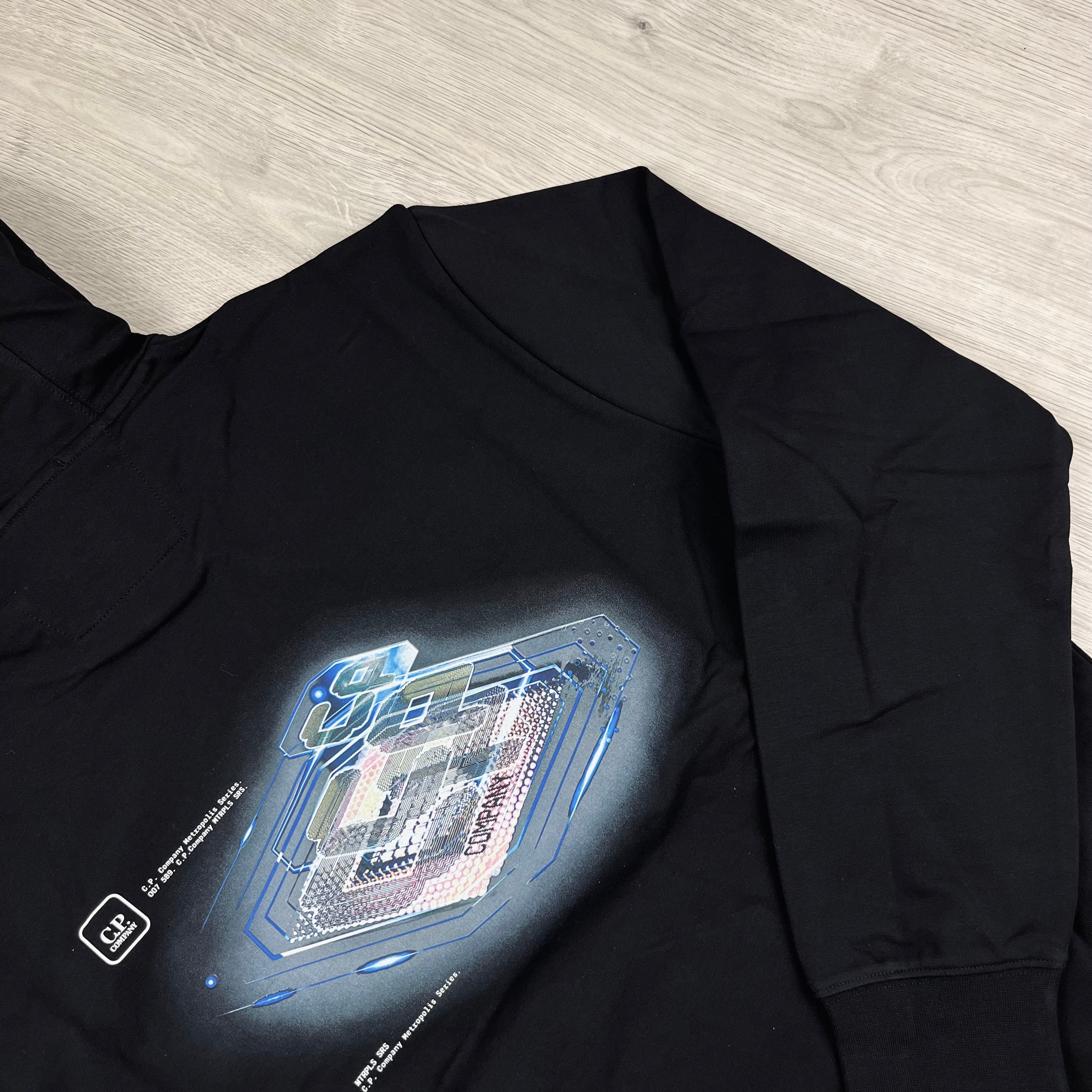 CP Company Metropolis Series Stretch Fleece Hoodie in Black. On sale at Open Attire.