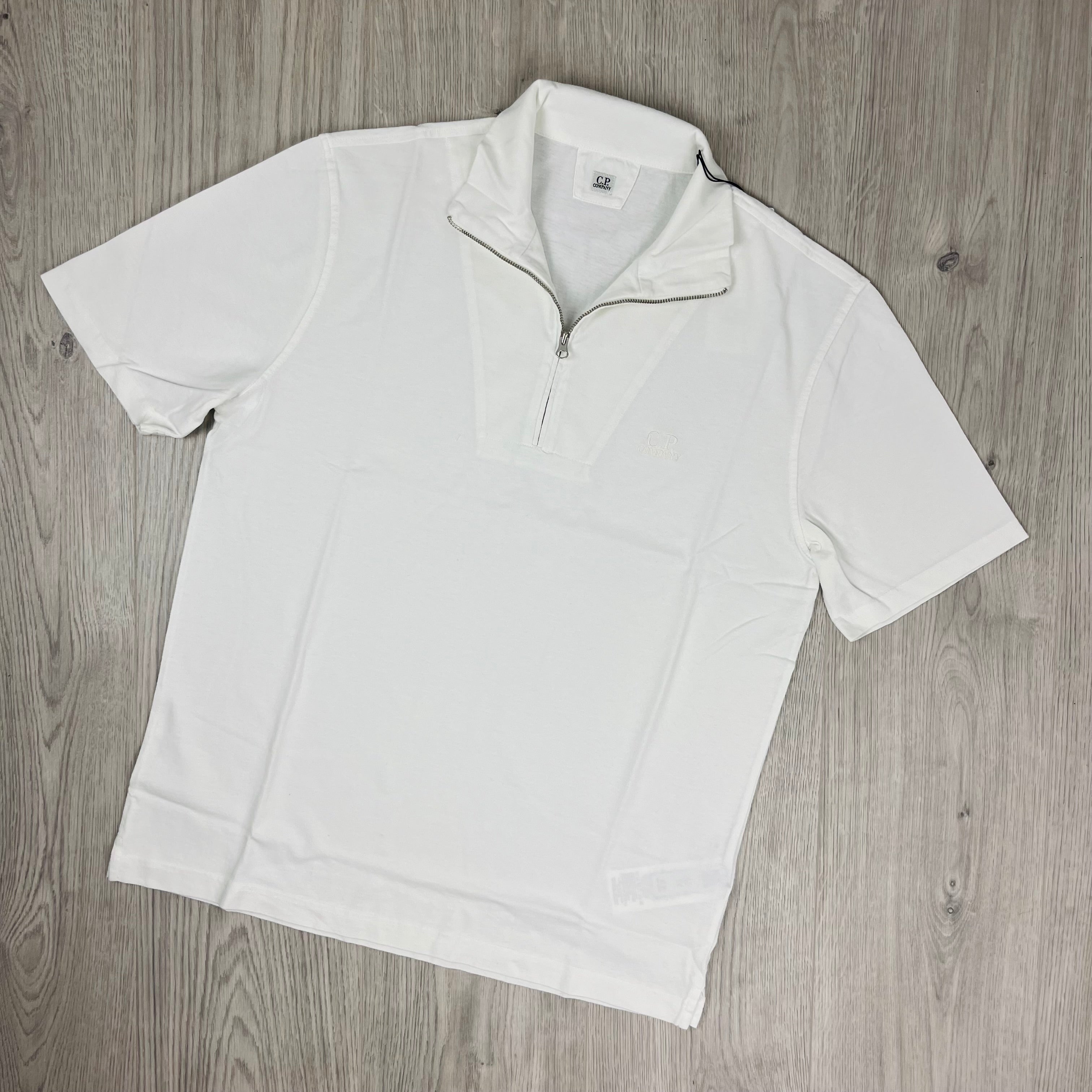 CP Company 1020 Zip Polo Shirt in Gauze White. On sale at Open Attire.
