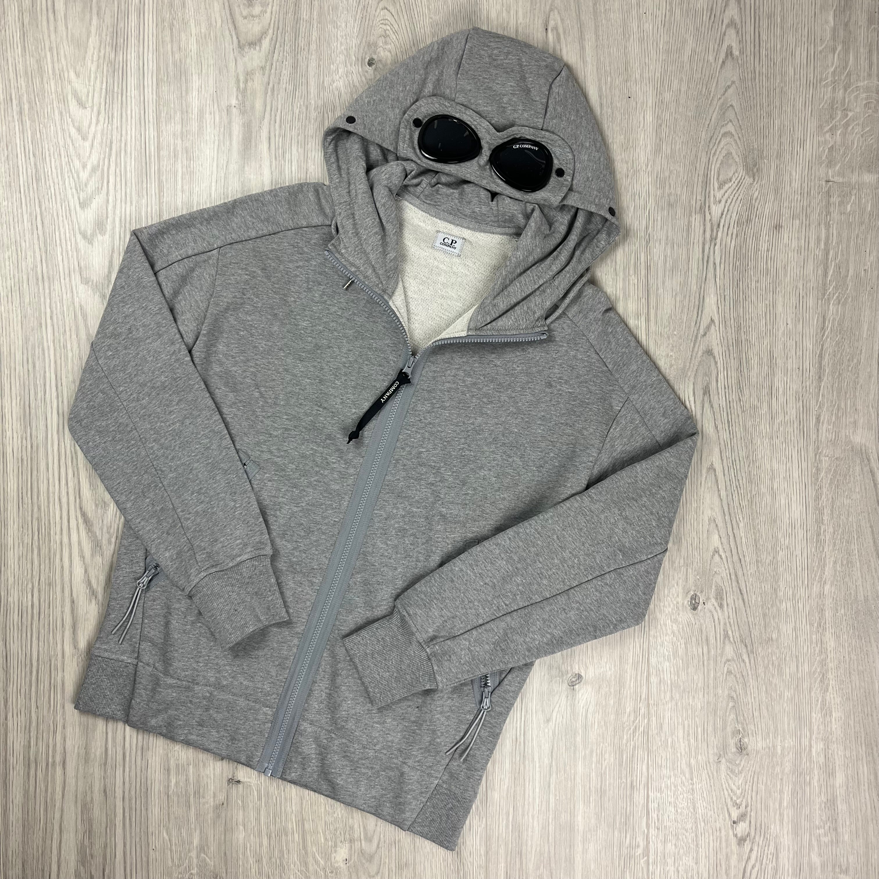 CP Company Raised Fleece Goggle Hoodie in Grey Melange. On sale at Open Attire.