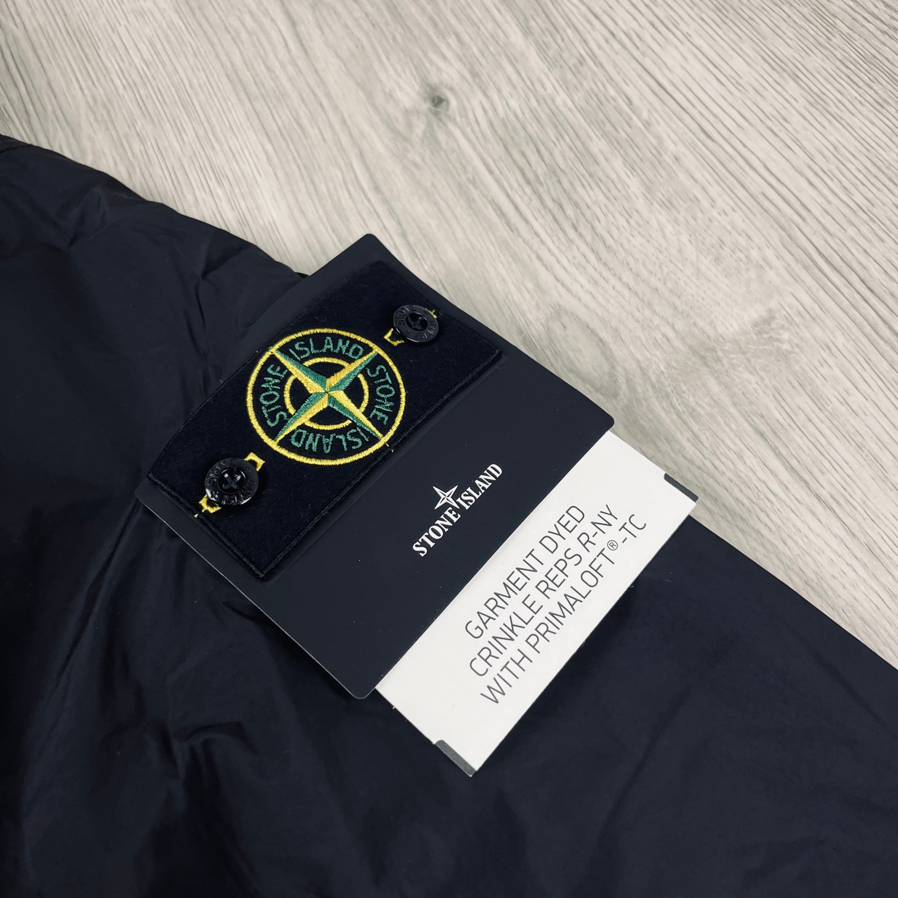 Stone Island Crinkle Reps R-NY Primaloft Jacket in Black. On sale at Open Attire. 