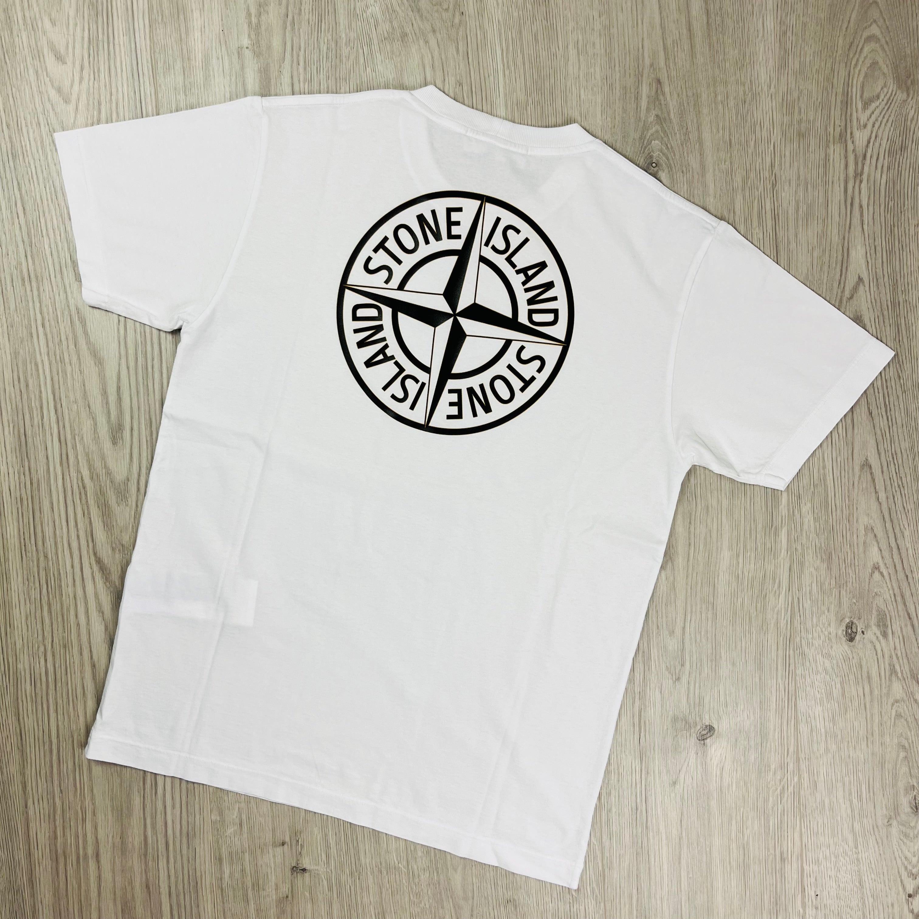 Stone Island 'Institutional Four' T-shirt in White. On sale at Open Attire.