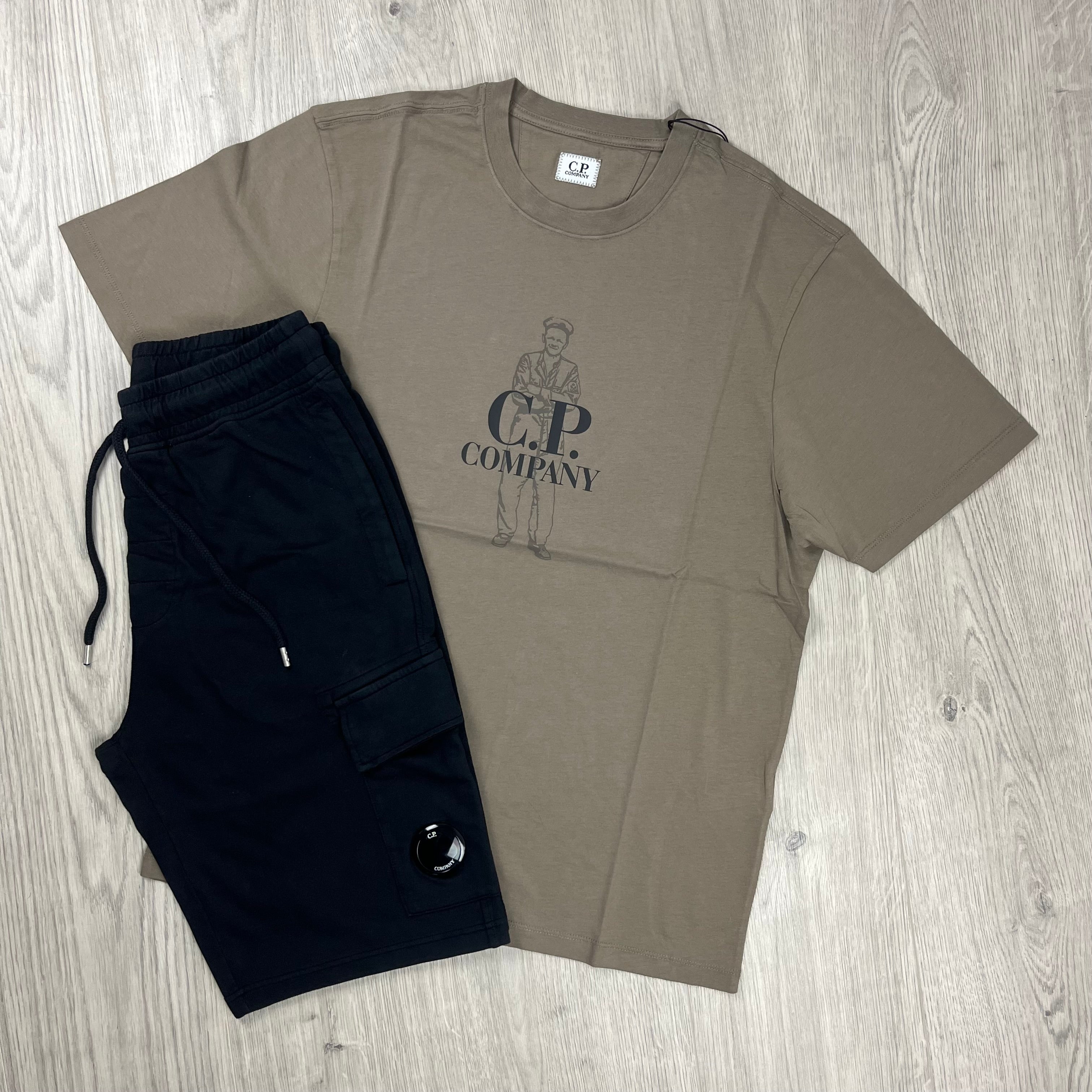 CP Company Tracksuit consisting of a Walnut T-shirt and Black jersey shorts. On sale at Open Attire.