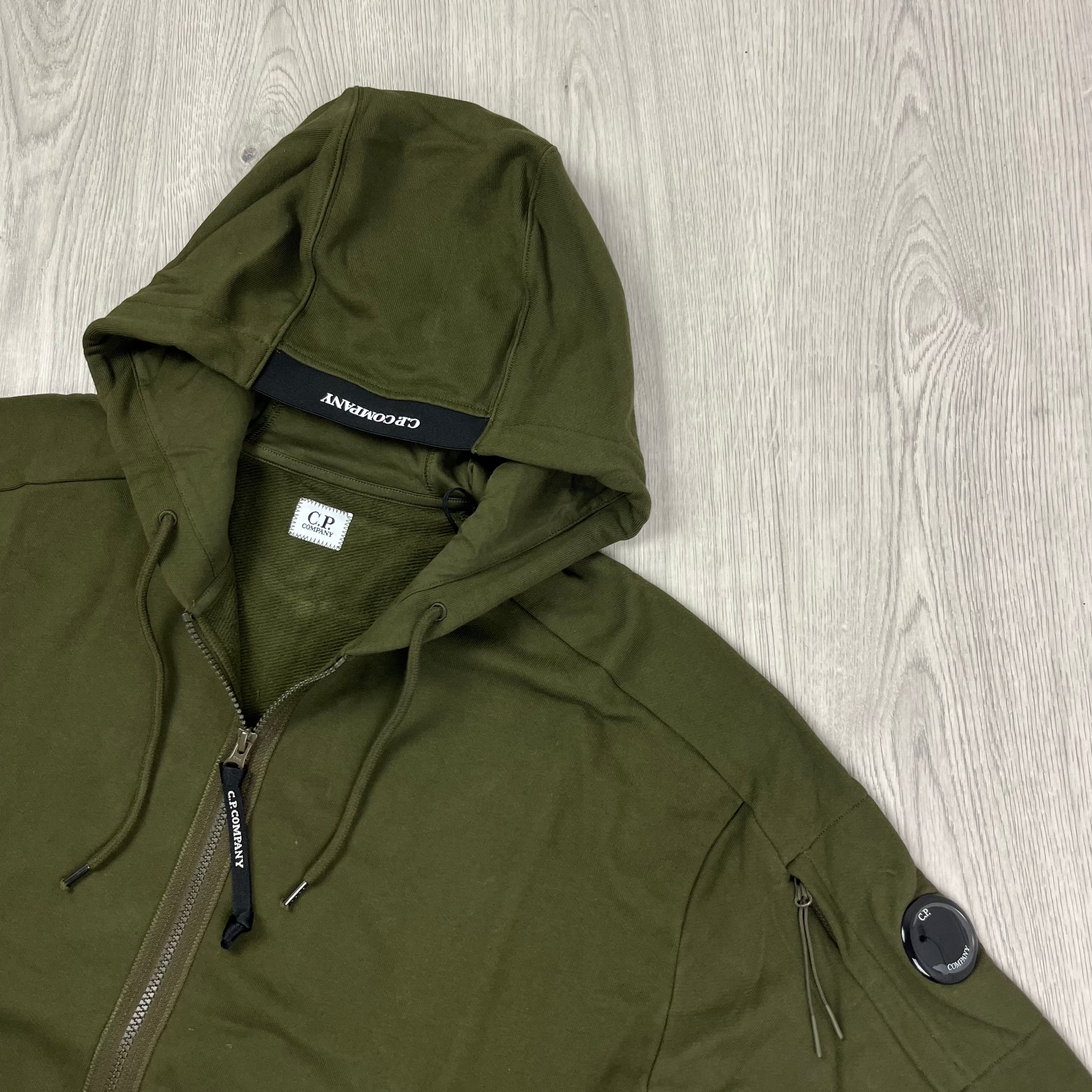 CP Company Diagonal Raised Fleece Zipped Hoodie with sleeve lens detail in Ivy Green. On Sale at Open Attire.