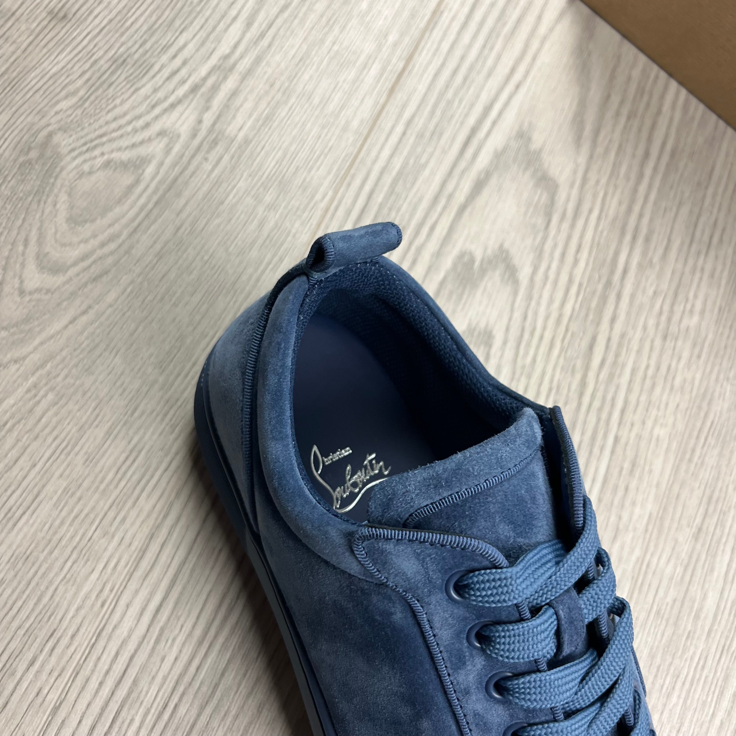 Christian Louboutin Louis Junior Sneakers in Denim Blue. On sale at Open Attire.