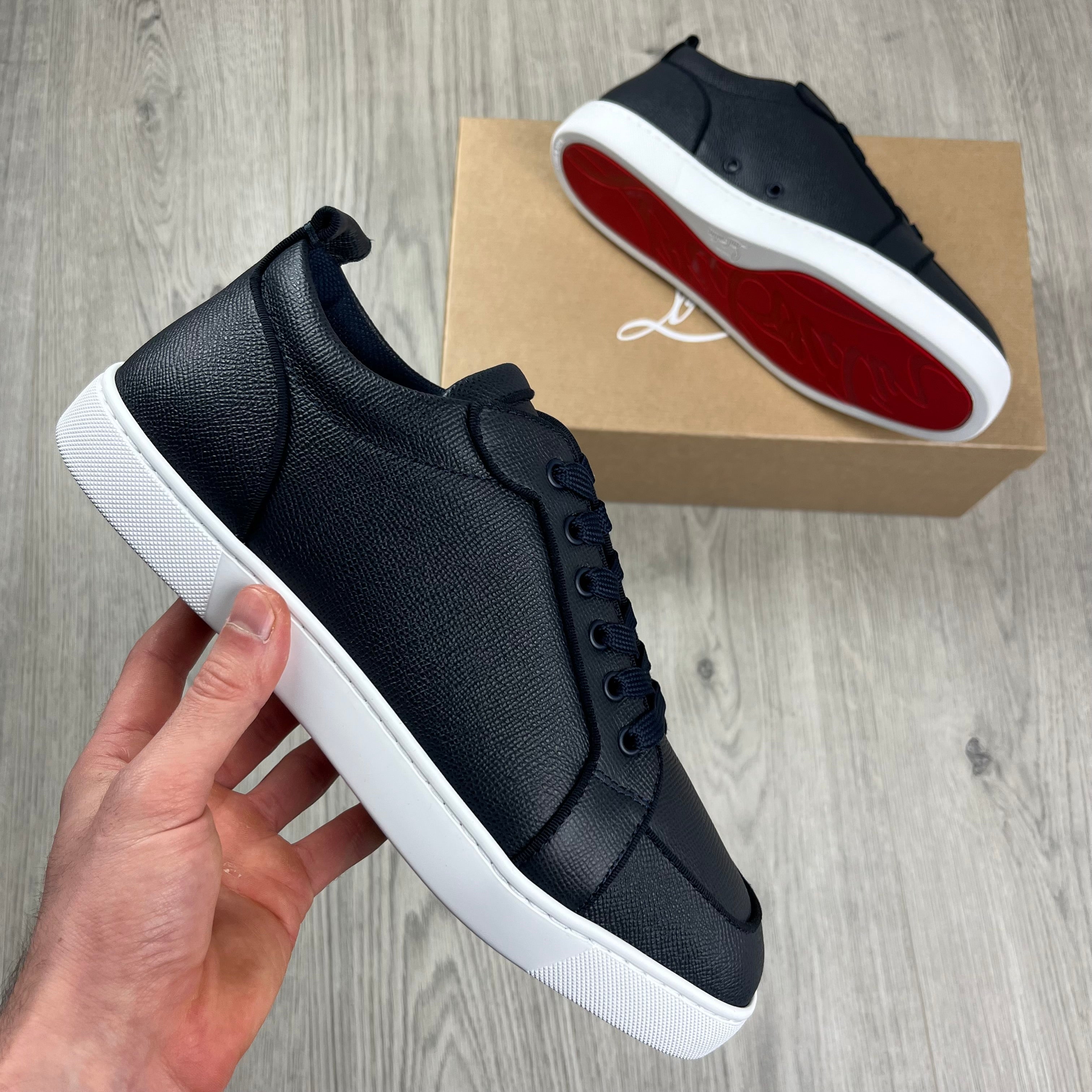 Christian Louboutin Rantulow Sneakers in Navy Marine. On sale at Open Attire.