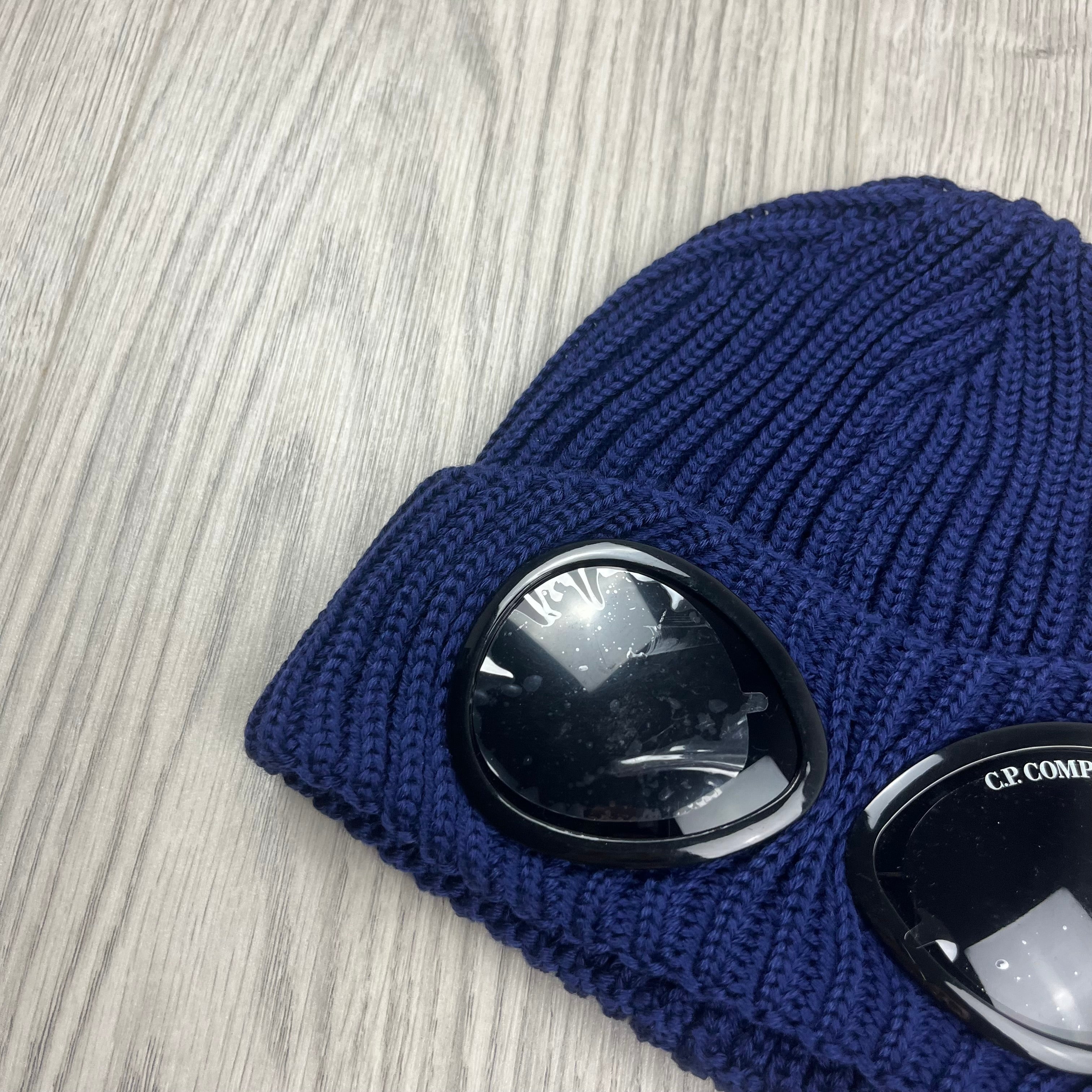 CP Company Merino Wool Lens Beanie in Estate Blue. On sale at Open Attire.