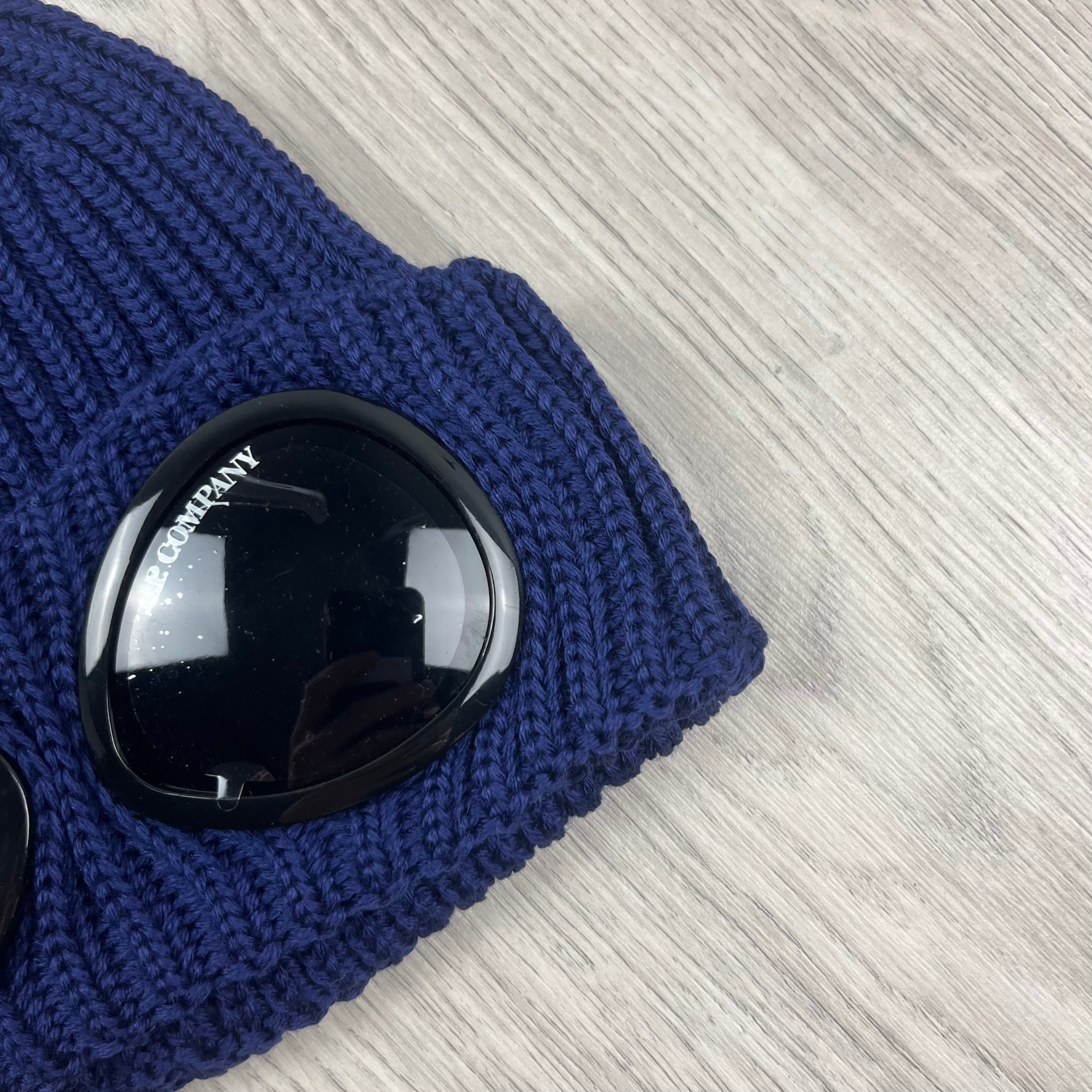 CP Company Merino Wool Lens Beanie in Estate Blue. On sale at Open Attire.