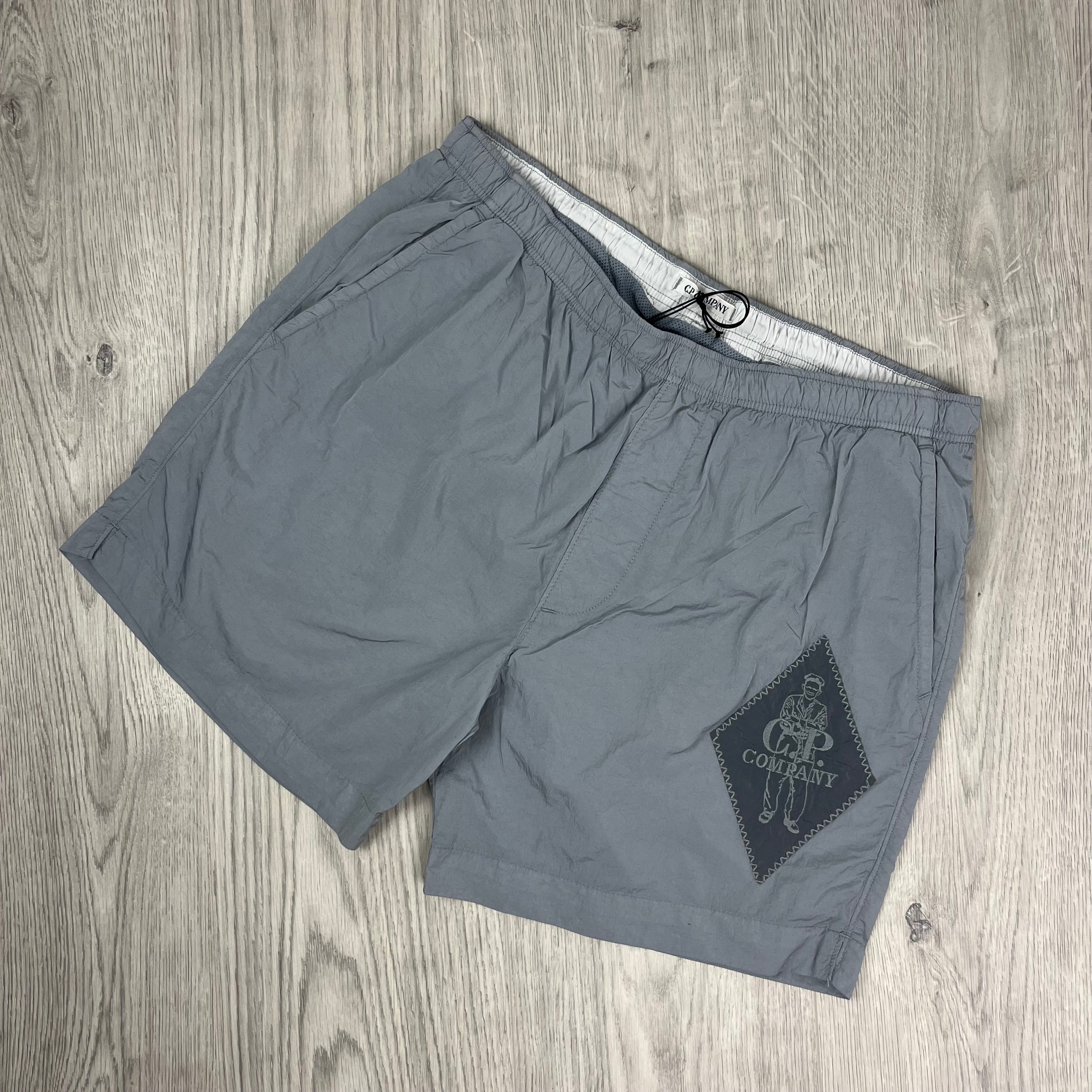 CP Company Sailor Swim Shorts in Limestone. On sale at Open Attire.