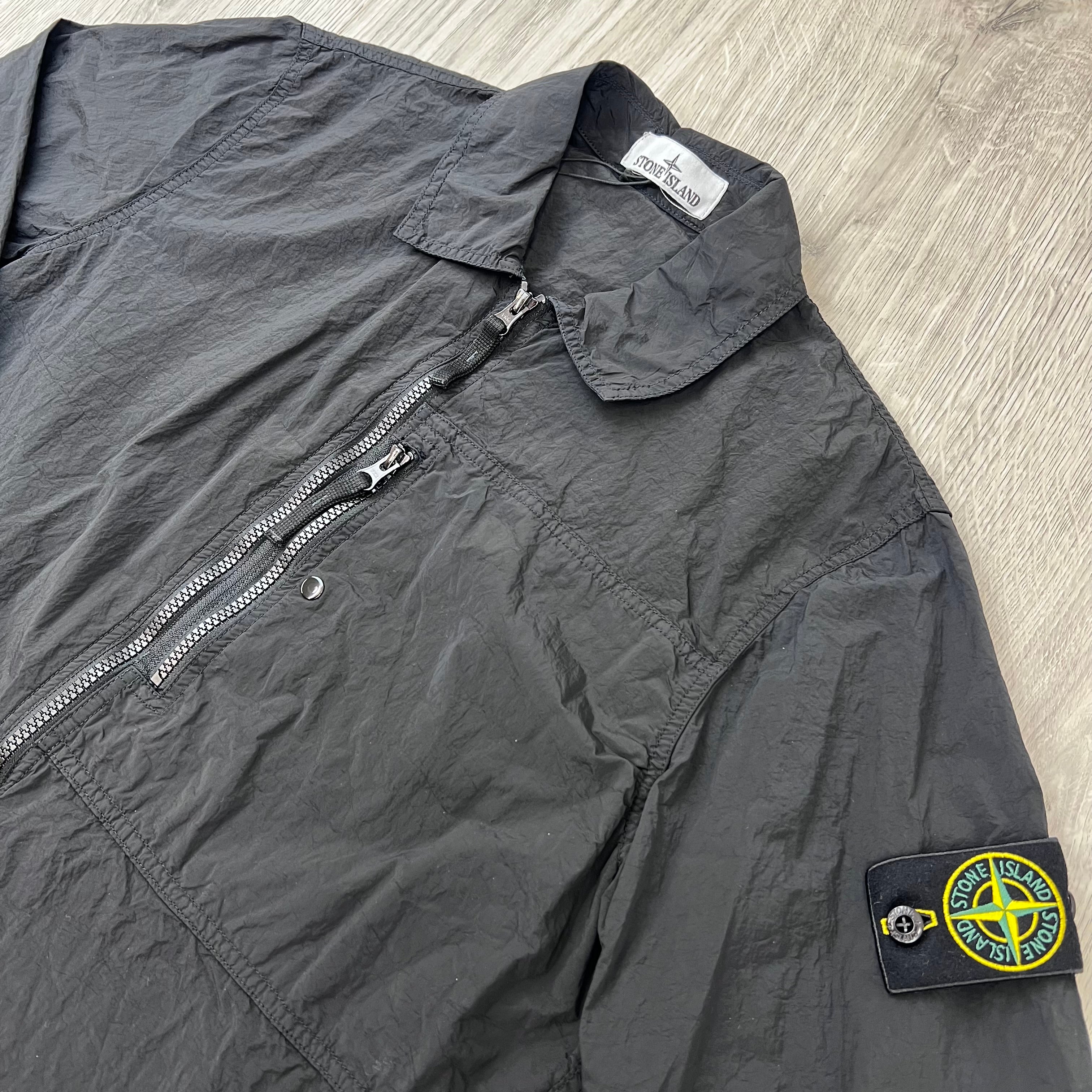 Angled view of the Stone Island Nylon Metal Overshirt in Black.